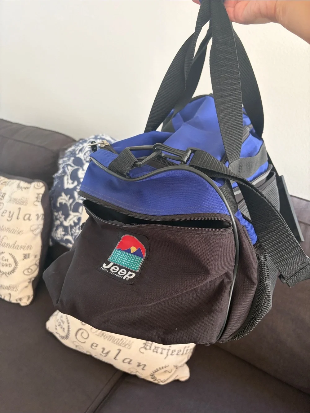 Jeep blue and black duffel bag with front mesh pocket.